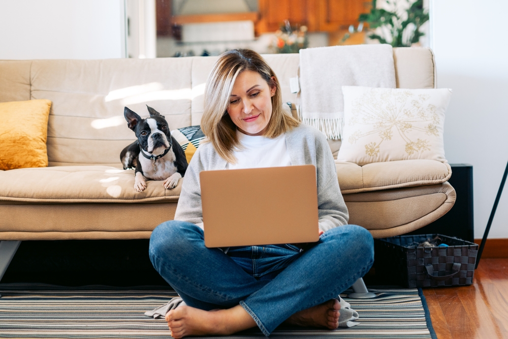 Freelancer,Businesswoman,Working,From,Home,With,A,Boston,Terrier,Dog